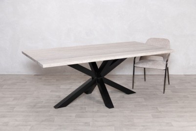 travertine-top-black-star-base-dining-table